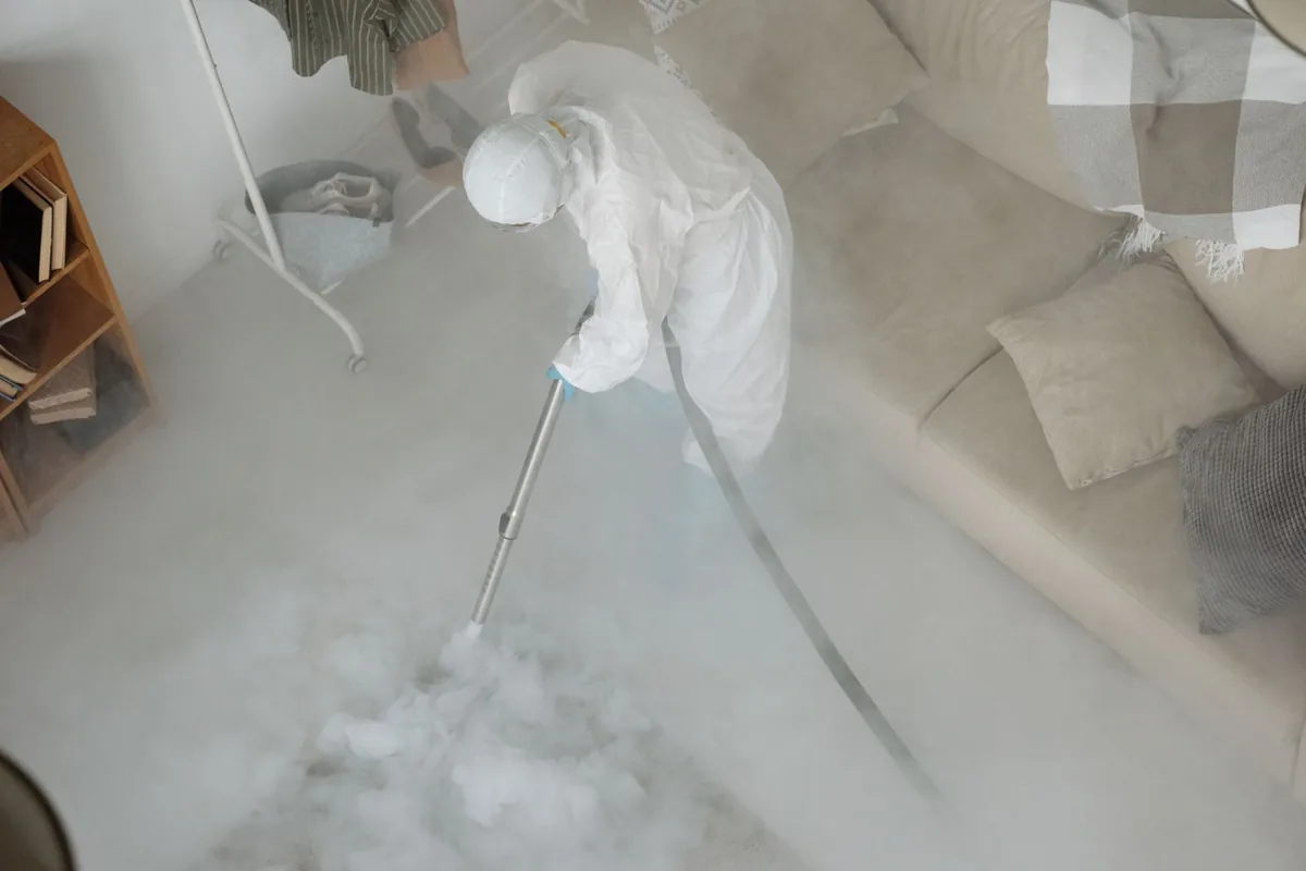 Biohazard cleanup technician in protective equipment, Del Monte Forest, CA